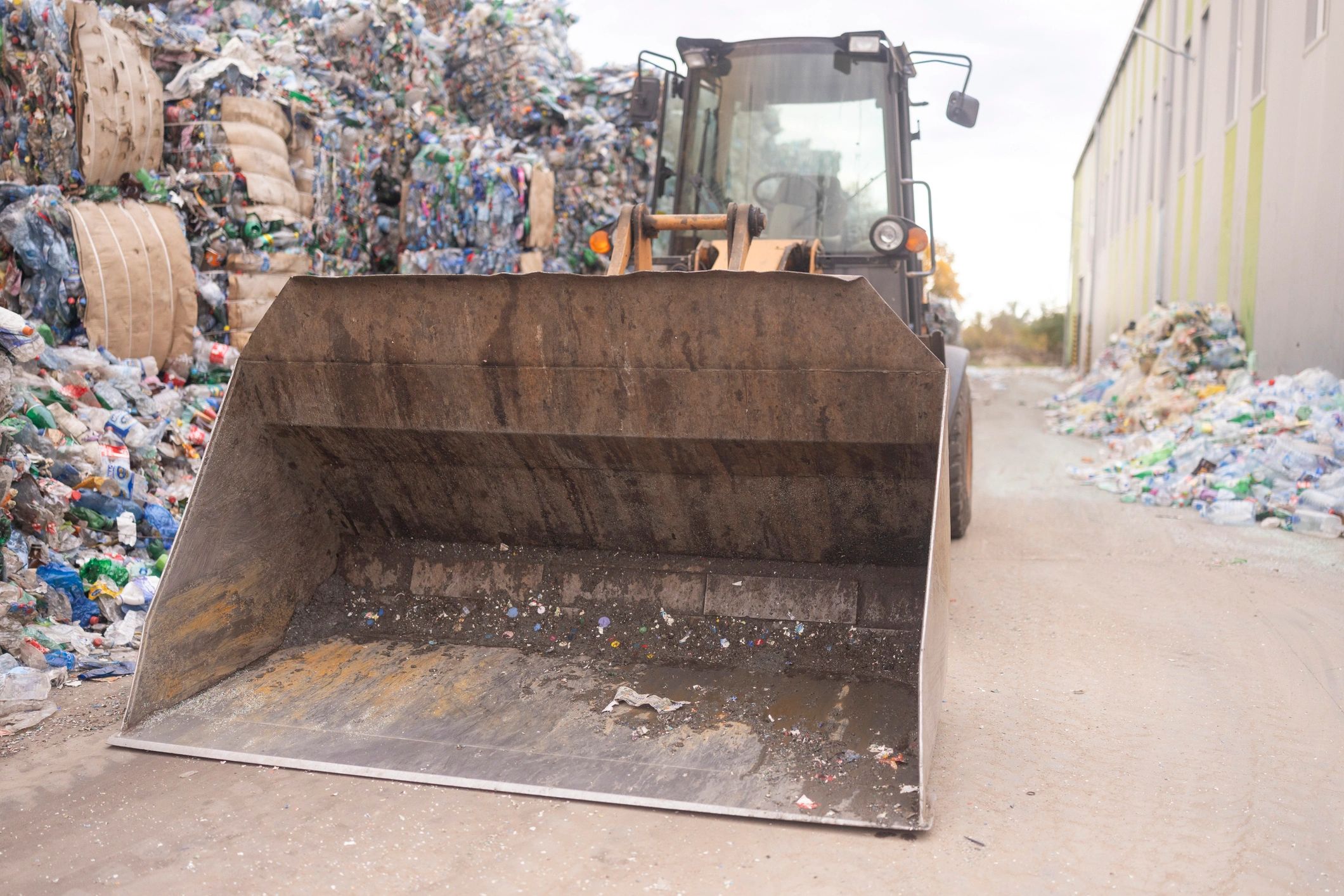 Heavy equipment handling recyclable construction materials