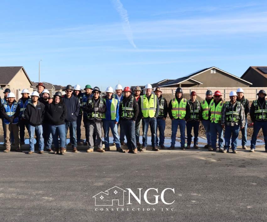 NGC Construction team of construction workers and supervisors standing together on a Central California job site