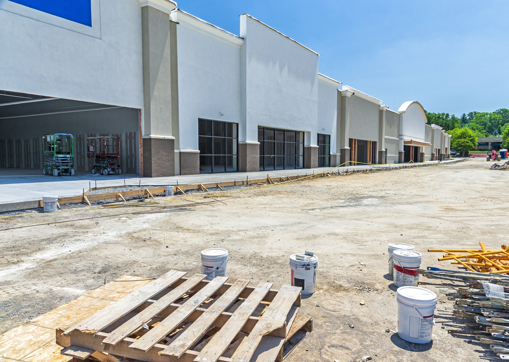 commercial construction Retail strip mall storefronts under construction with stucco exterior finish