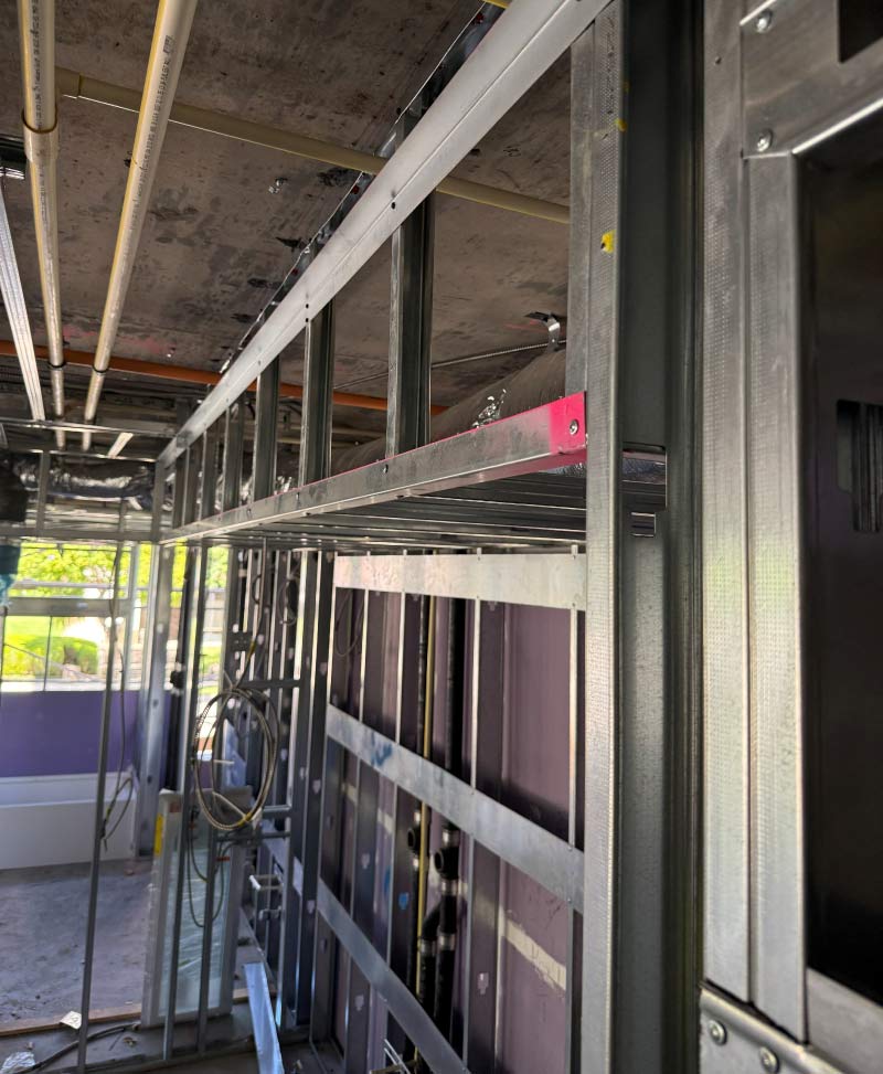 Light-gauge metal framing structural connection detail in a multifamily building under construction